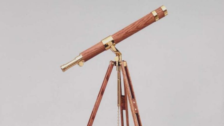 telescopes by glass eye shows a brass wood telescope with a grey background