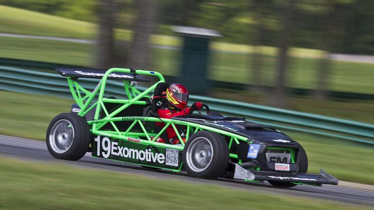kit car by exomotive a green race car racing on a track