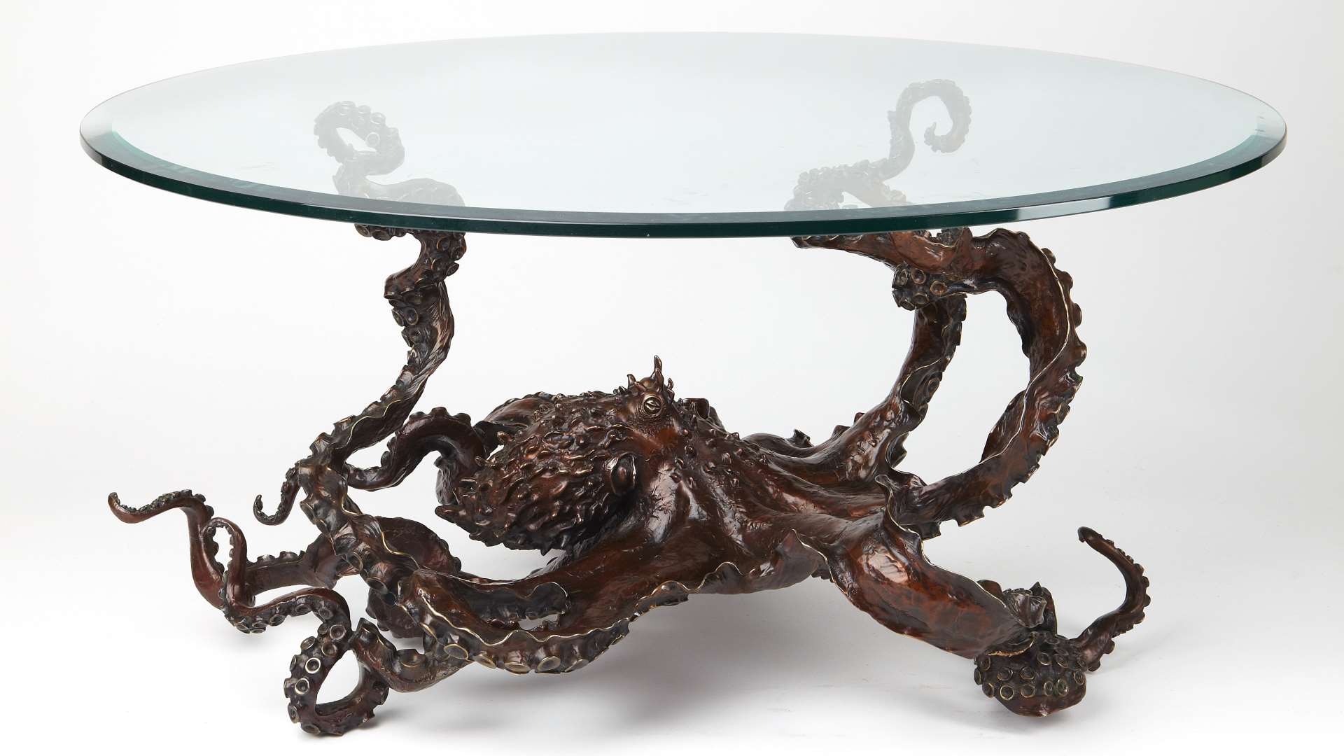 bronze sculptures by Kirk McGuire a bronze glass octopus table with white background
