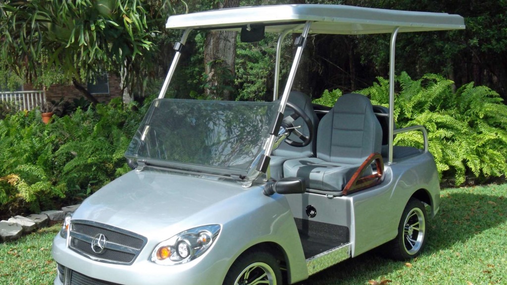 golf carts by luxury golf carts features a silver cart on a manicured lawn