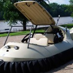 hovercrafts by Neoteric shows a hovercraft on a parking lot with a body of water in the background