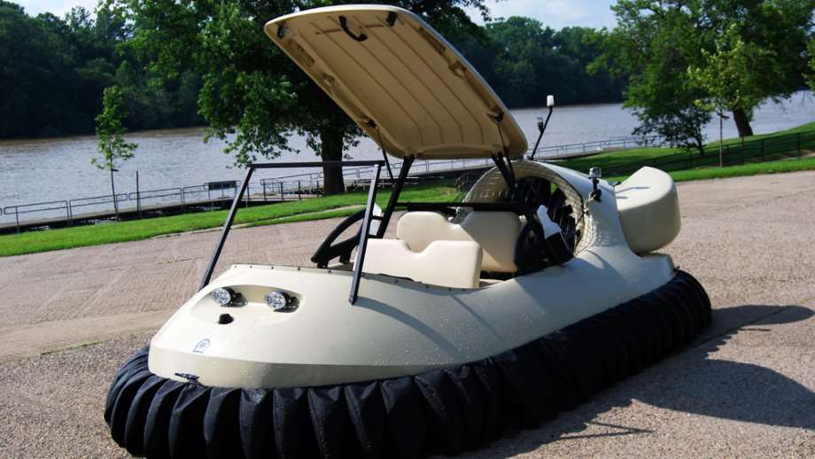 hovercrafts by Neoteric shows a hovercraft on a parking lot with a body of water in the background