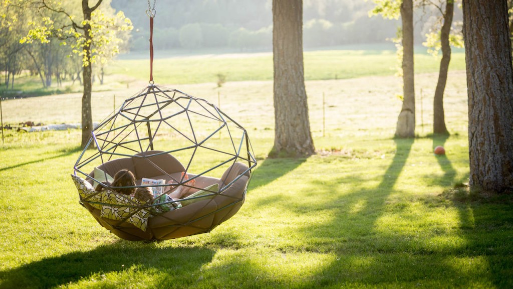 outdoor furniture by Kodama Zomes swing chair hanging from a tree
