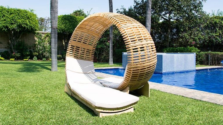 lounge chair by loopita in front of a pool