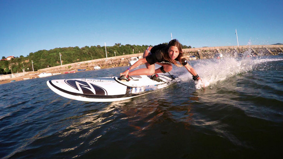 electric jet boards by Onean Electric JetBoard woman surfing in a body of water