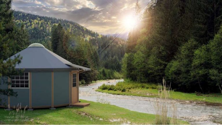 yurt cabin by freedom supply company a grey yurt sitting on a river