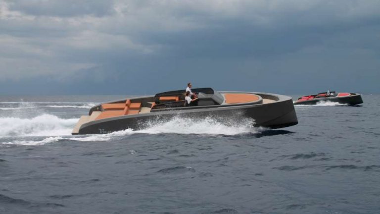 yachts by Vanquish Yachts in the ocean racing another boat | ToysForBigBoys.com