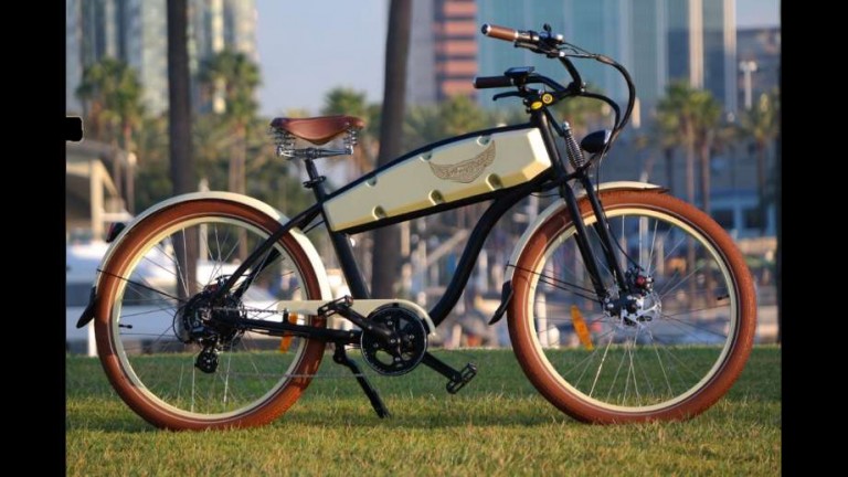 ebikes by Ariel Rider a bike standing up with a city background