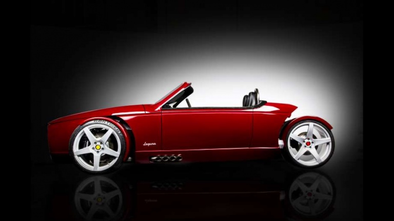 roadster by Vanderhall motor works a red roadster with black background