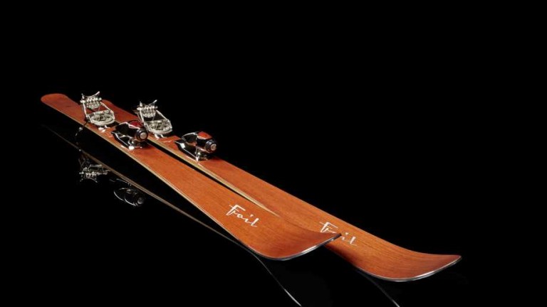 skis by Foilski a pair of luxury skis with a black background