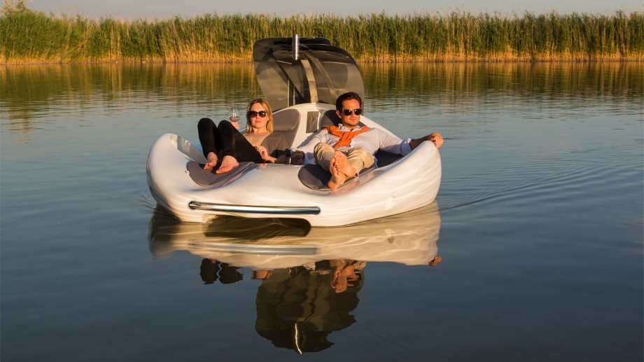 luxury boats by Chilli Island on the water with a couple
