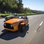 Small electric vehicles featuring an orange roadster by Vanderhall