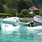 amphibious aircraft by Lisa Akoya floating in a body of water