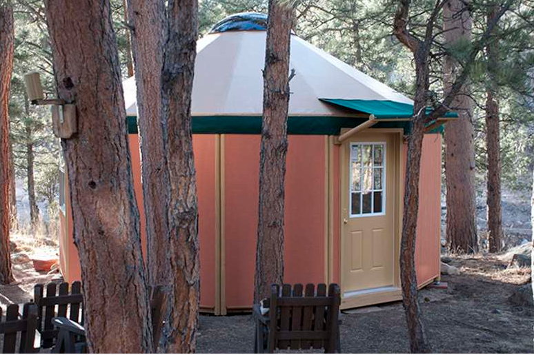 glamping showing yurt cabins on a body of water