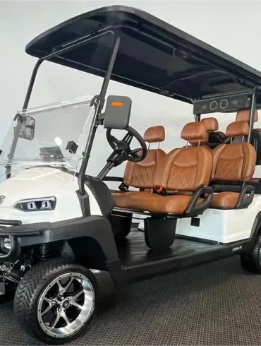 48-Volt C6L six-seater lifted golf cart by Royal EV featuring tan leather seats, alloy wheels, and black roof.